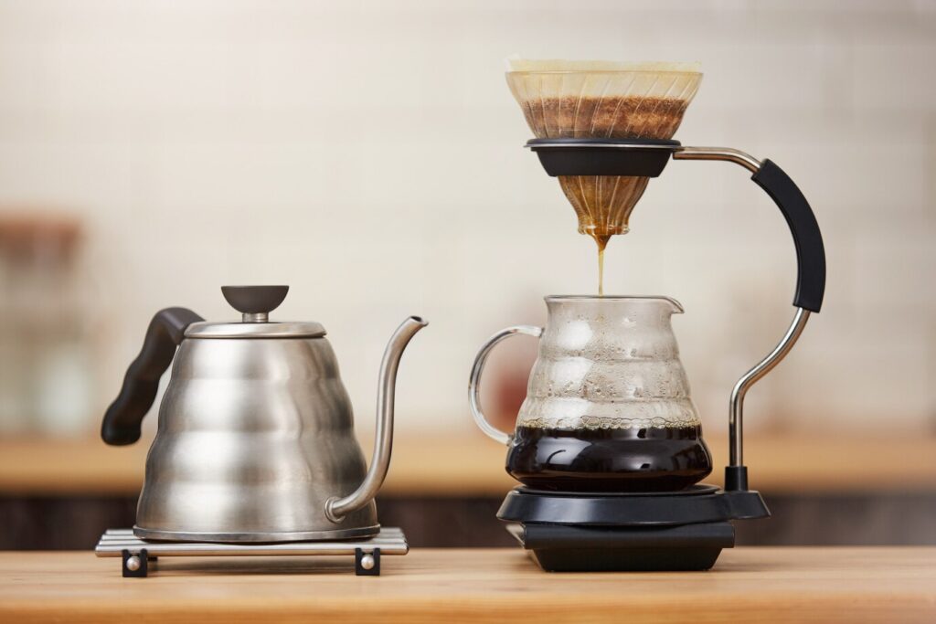 close-up-coffee-brewing-gadgets-wooden-bar-counter_176420-7894