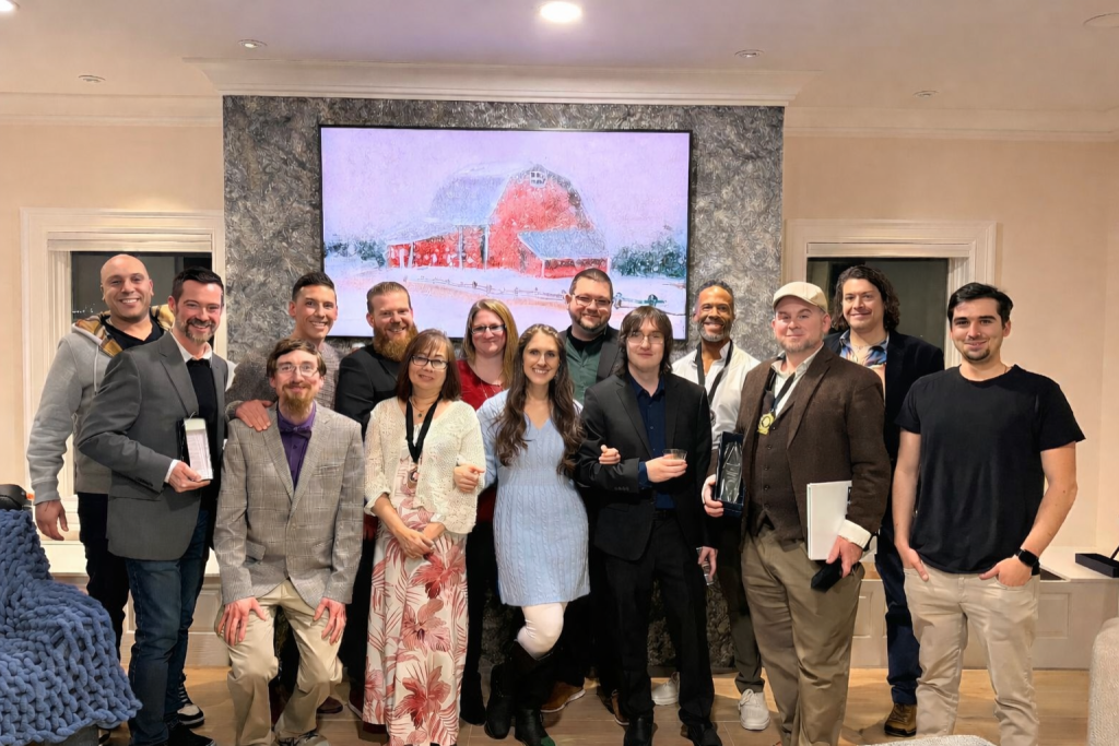 team standing for remarkablism celebration